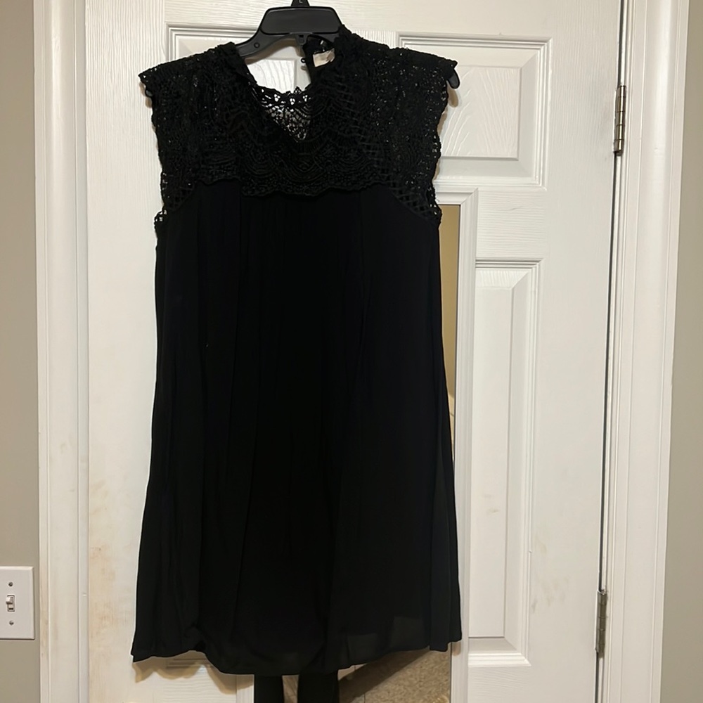 So cute on! Has a high lace neck so perfect for a church dress or anything.